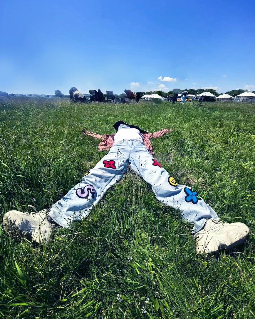 A relaxed moment in the grass during Noah’s travels